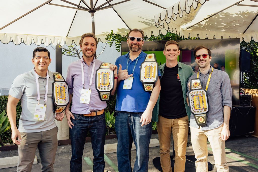 Matthew Robertson and fellow winners holding championship belts at Airspace LA